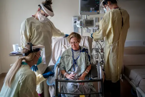 Kathleen Flynn / Reuters A woman is treated for Covid-19 at the Ochsner Medical Center in Jefferson Parish, Louisiana, US, on 10 August 2021