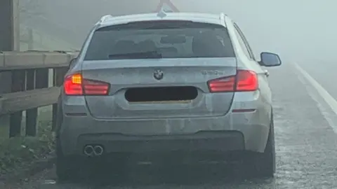 @roadpolicebch Car stopped by police in fog