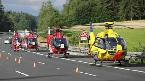 Reuters Rescue helicopters at bus crash scene on A9 near Hof (3 July)