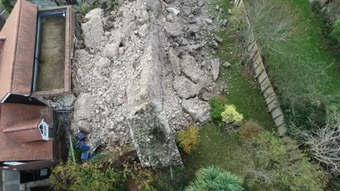 Eddie Mitchell Wall collapse