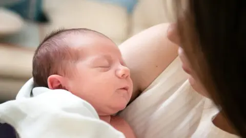 BBC Newborn baby with its mother