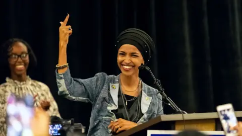 Getty Images Ilhan Omar celebrates.