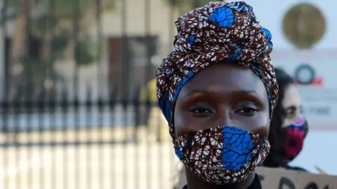Getty Images Woman wearing mask