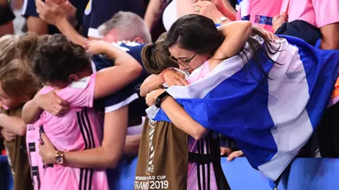 Getty Images Scotland fans and players