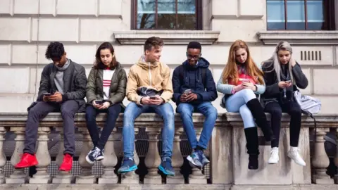 Getty Images Teens on smartphones