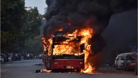 AFP A bus burns in Delhi, 15 December