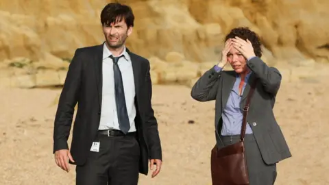 ITV/REX/Shutterstock David Tennant and Olivia Colman in Broadchurch (2013)