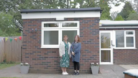 Dorset Council two women stand outside a bungalow