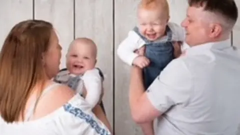 Leanne Stokes Leanne, partner Jamie and their twins