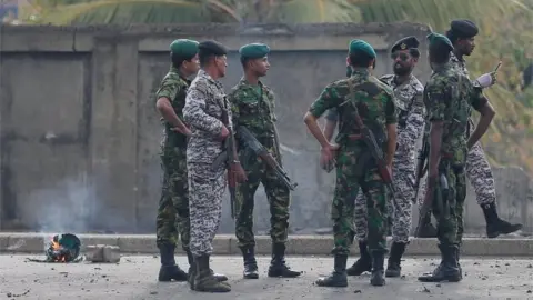 Reuters Special Task Force Bomb Squad officers inspect the site of an exploded van near a church that was attacked yesterday in Colombo, Sri Lanka April 22, 2019