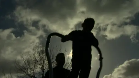 BBC Child playing in silhouette