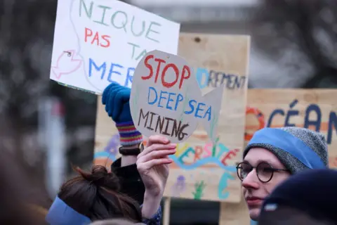 Getty Images Activists take part at a "Look Down action" rally to stop deep sea mining