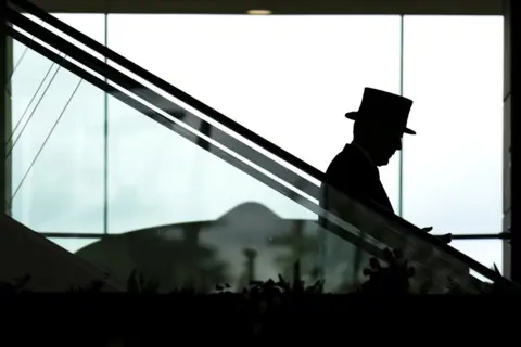 John Walton/PA Media A silhouette of racegoers during day five of Royal Ascot at Ascot Racecourse, Berkshire