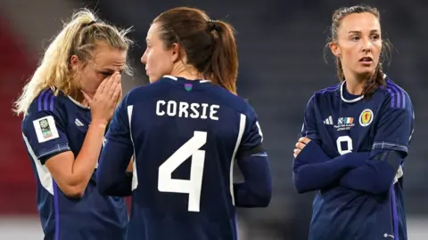 Claire Emslie, Rachel Corsie, and Caroline Weir look depsondent after losing to the Republic of Ireland