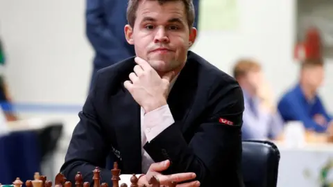 Reuters Magnus Carlsen plays chess in 2018