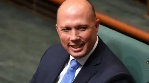 EPA Home Affairs Minister Peter Dutton sits in parliament