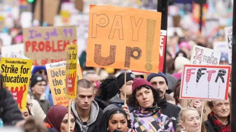 PA Media Marching strikers