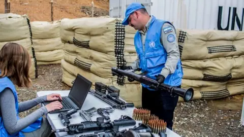 AFP UN observers checking weapons handed by the FARC ,Cauca Department, Colombia on June 13, 2017.