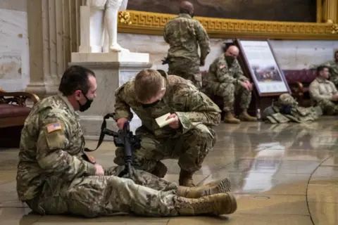 EPA US National Guard soldiers taking a break inside the US Capitol in Washington