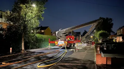 Herts Specials A fire engine dealing with a fire at Balmoral Drive, Borehamwood
