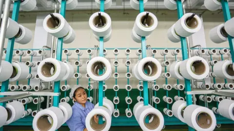 Getty Images Chinese worker in factory