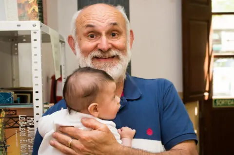 Dani Rotstein Toni Pinya holding Dani's baby son, Oren