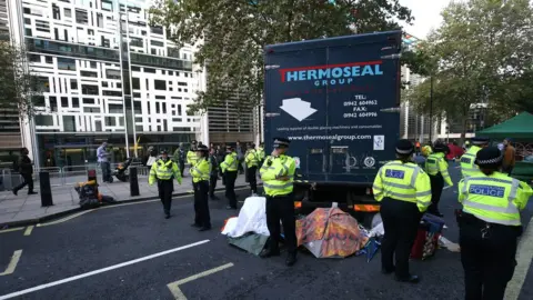 PA Media A lorry blocks the road outside the Home Office