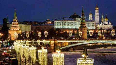 AFP/Getty Images A night-time picture of the Kremlin complex and the Bolshoy Kamenny bridge in Moscow.