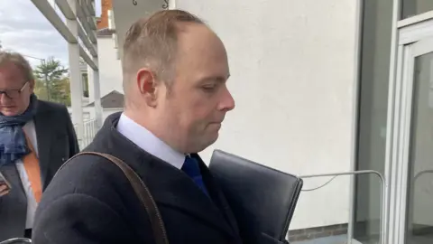 Matt Precey/BBC David Mackintosh arriving at court
