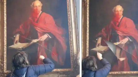 Palestine Action Woman damaging painting of Lord Balfour