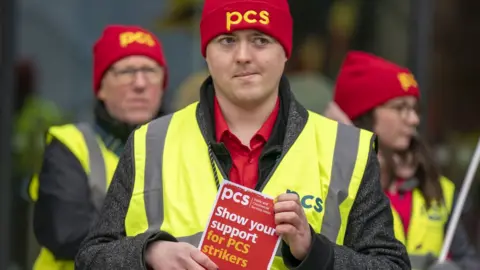 PA Media Member of the PCS union on strike