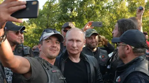 AFP/Getty Putin with a motorcycle gang in Crimea, 2019