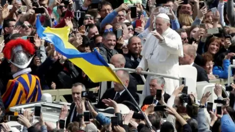 Reuters Pope Francis greets the faithful from his Popemobile after the Easter Mass at St Peter's Square at the Vatican April 1, 2018