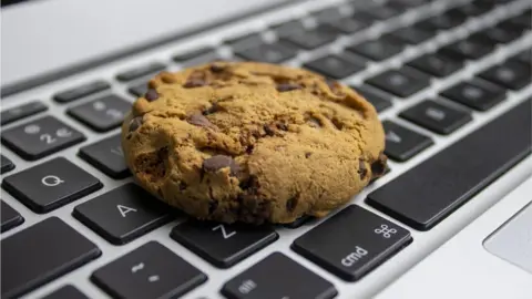 Getty Images A chocolate chip cookie on a keyboard