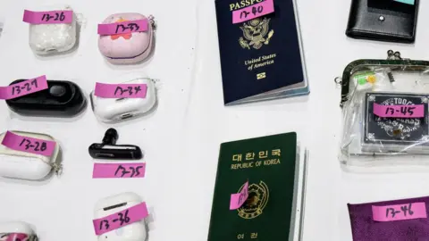 Getty Images Close up of victims passports, earphones and belongings.