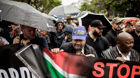 AFP South African opposition party Congress of the People (COPE) leader Mosiuoa Lekota (R) and members of the South African civil society organisation AfriForum and other civil organisations march to the Union Buildings to raise awareness on farm attacks on November 25, 2017 in Pretoria