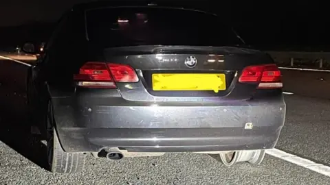 Thames Valley Police Car with no tyre