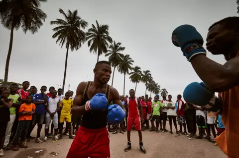 Hugh Kinsella Cunningham Sparring outside the Stade Tata Raphael