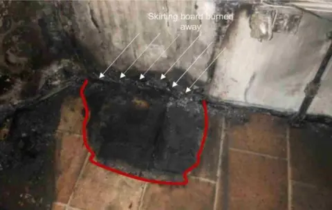 Grenfell inquiry The burn marks underneath the fridge-freezer in flat 16