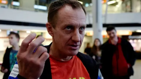 Reuters Denis Urubko speaks before the departure of the Polish national team for the expedition to scale K2 in the winter, at an airport in Warsaw