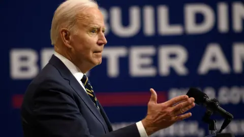 Getty Images US President Joe Biden speaks at Mill 19, a former steel mill being developed into a robotics research facility, on the campus of Carnegie Mellon University on January 28, 2022 in Pittsburgh, Pennsylvania