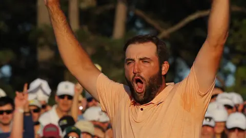 Scottie Scheffler celebrates winning the 2024 Masters