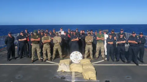 Ministry of Defence British sailors, Royal Marines and a US Coast Guard team on HMS Trent intercepted a smuggling speedboat