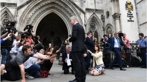 EPA Press and media surround a spokesman for Charlie Gard's family