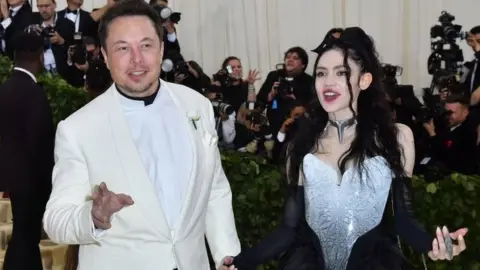 AFP Elon Musk and Grimes