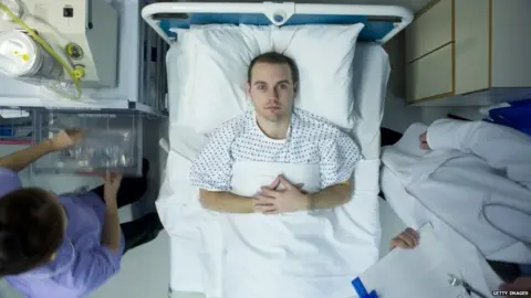 Getty Images Man in hospital bed