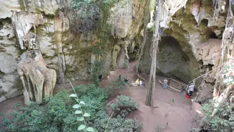 Mohammad Javad Shoaee General view of the cave site of Panga ya Saidi. Note trench excavation where burial was unearthe (c) Mohammad Javad Shoaee