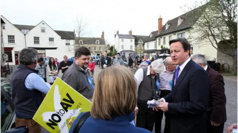 PA Media David Cameron hands out No to AV leaflets in Eynsham, Oxfordshire