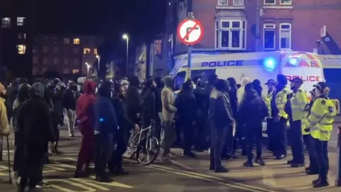 Leicester Media Crowd of people and police officers in Leicester