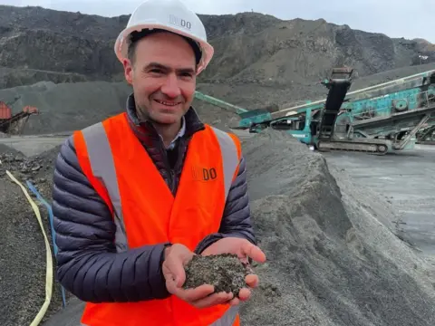 BBC Jim holding basalt dust